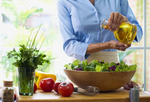 getty rm photo of woman dressing salad