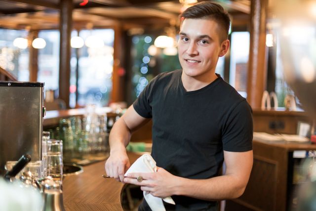 man with cup looking camera