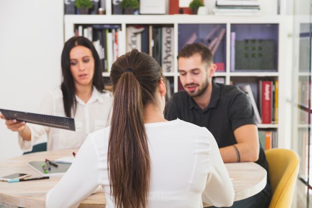 woman sitting office talking