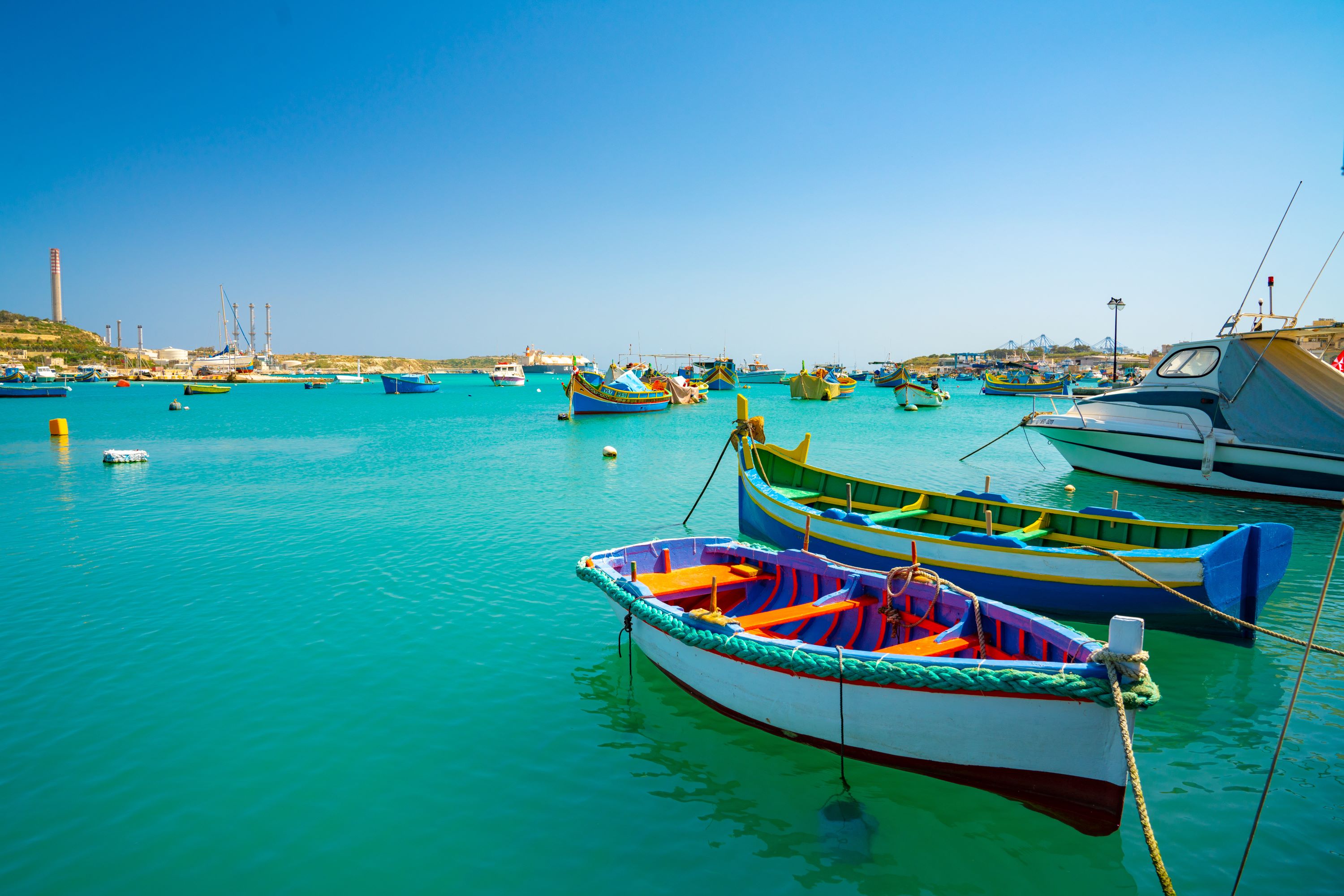 view traditional fishing boats luzzu marsaxlokk harbor malta